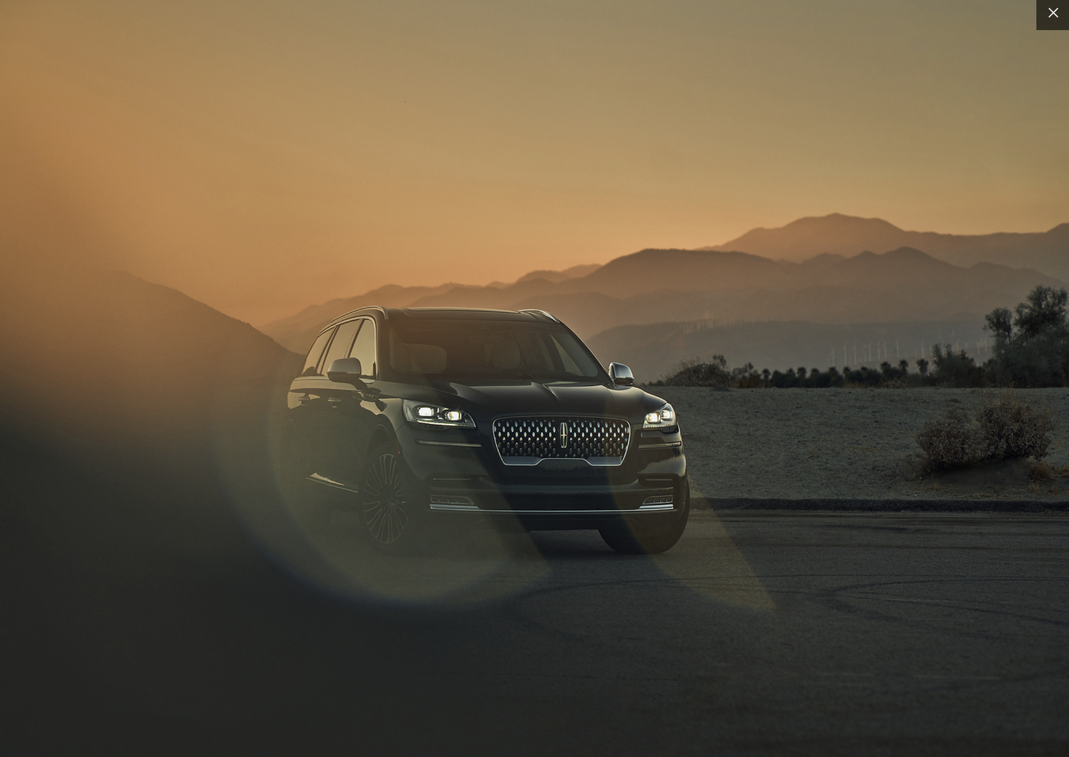 Pickup truck at golden hour near industrial area
